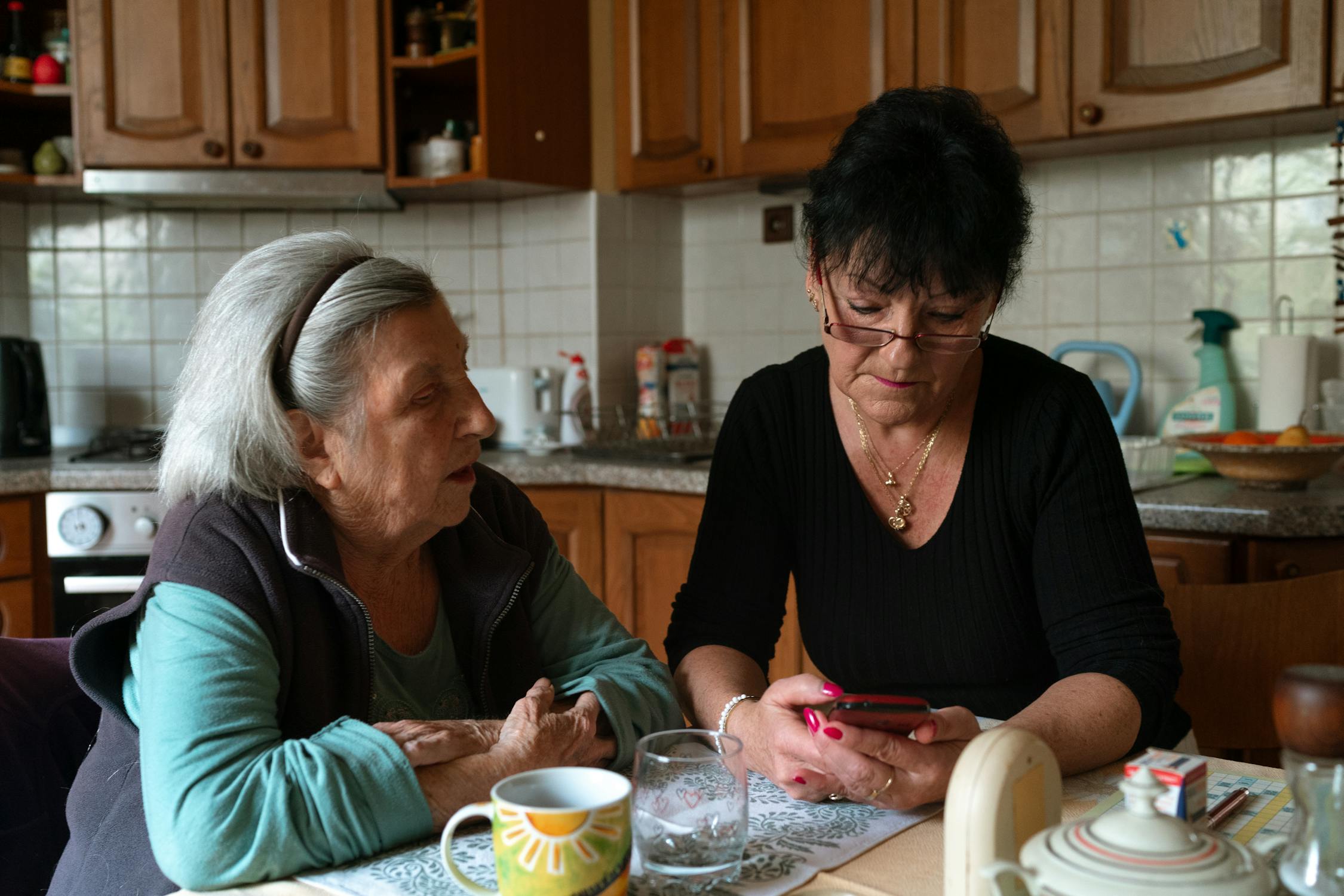 Senior woman happily using a smartphone