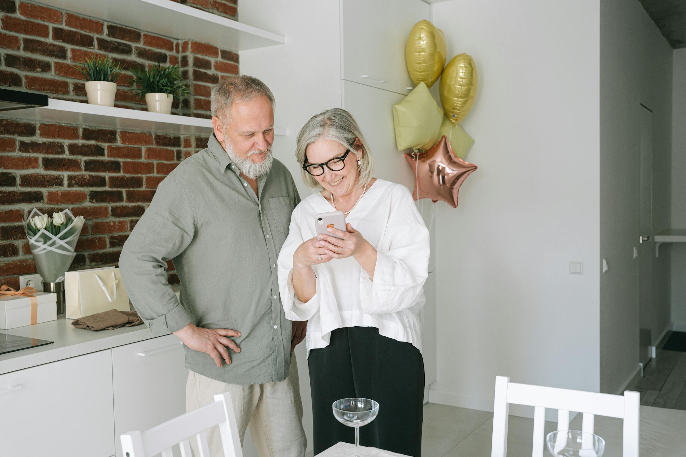 Senior woman smiling while using her phone outdoors